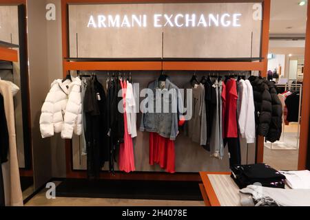 ARMANI EXCHANGE CLOTHING ON DISPLAY INSIDE THE FASHION STORE Stock