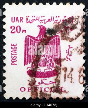 EGYPT - CIRCA 1966: a stamp printed in Egypt shows Arms of UAR (Egypt), circa 1966 Stock Photo