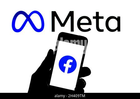 Barcelona, Catalonia, Spain. 30th Oct, 2021. In this photo illustration a Facebook logo seen displayed on a smartphone with a Meta logo in the background. (Credit Image: © Thiago Prudencio/DAX via ZUMA Press Wire) Stock Photo