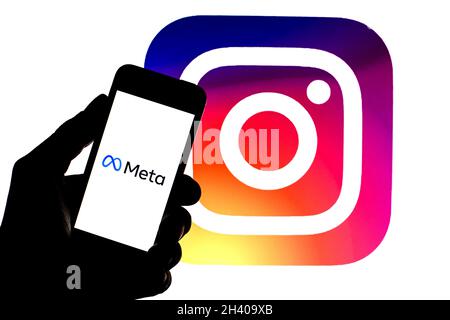 Barcelona, Catalonia, Spain. 30th Oct, 2021. In this photo illustration a Meta logo seen displayed on a smartphone with a Instagram logo in the background. (Credit Image: © Thiago Prudencio/DAX via ZUMA Press Wire) Stock Photo