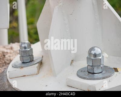 Top view of cup head nuts hold support axe of view tover built on granite rosck Stock Photo