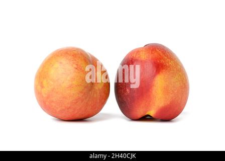Ripe round red nectarine isolated on white background, tasty and healthy fruit, close up Stock Photo