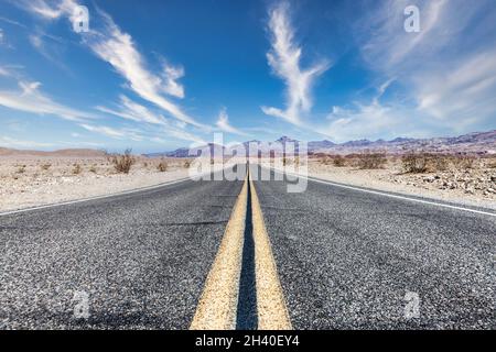 Route 66 in the desert with scenic sky. Classic vintage image with nobody in the frame. Stock Photo