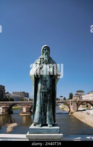 SKOPJE, NORTH MACEDONIA - AUGUST 19, 2021: Bronze statue of historical figures on Vardar river bridge in Skopje Stock Photo