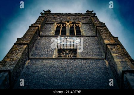 A stylized low angle view of the main tower of the Parish church in Cromer, Norfolk, UK Stock Photo