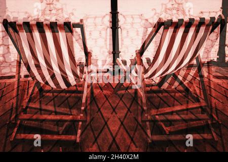 Montage of two empty Deck chairs looking out to sea on Brighton pier Stock Photo