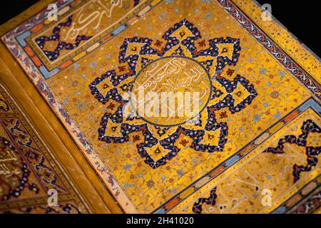 ISTANBUL, TURKEY - AUGUST 8, 2021: Close up of open Quran on display in the museum collection of Topkapi Palace Stock Photo