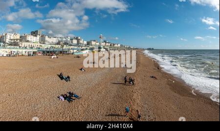 Panoramic view looking east along the beach in Brighton from Palace Pier, Brighton seafront, East Sussex, UK. Stock Photo