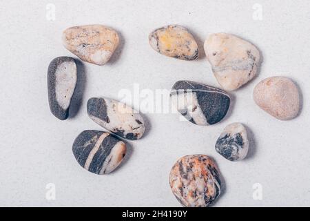 Group of different gray pebble stones, top view Stock Photo