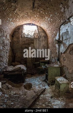 Old abandoned prison cell in Eastern State Penitentiary, USA Stock Photo