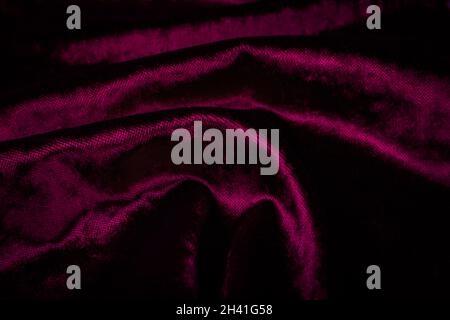 Abstract purple creasy velvet fabric background texture. beautiful luxurious fabric for draperies, curtains, bed cover, love Valentine day backdrop. Stock Photo