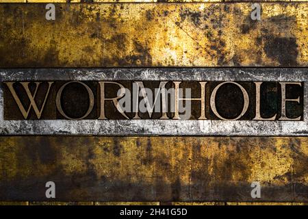 Wormhole text on vintage textured copper and gold background Stock Photo