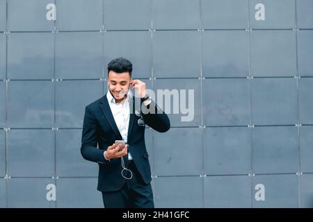 Handsome arabic man takes selfie smart phone in business center Stock Photo