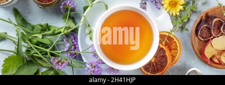 Tea panorama with herbs, flowers and fruit, shot from above Stock Photo