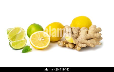 Ginger root, lemon, lime and mint leaves on a white background. Vitamin C, anti-cold fruit Stock Photo