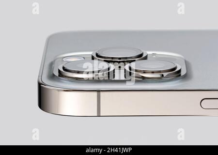 mobile phone camera close-up. modern technological video and photography on the phone using three built-in cameras. gray mobile phone close-up. Stock Photo