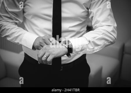 Grayscale Shot Of The Bride Getting Ready For The Wedding Stock Photo Alamy