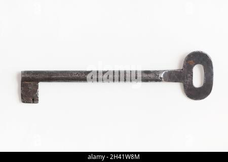Single old keys on white background. Clipping path. Ancient and old keys. Stock Photo