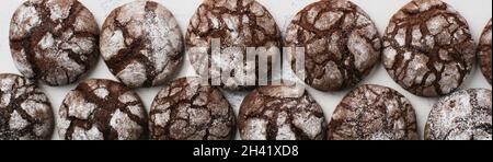Chocolate brownie cookies in powdered sugar. Chocolate Crinkles. Stock Photo