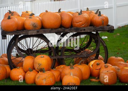 Ascot, Berkshire, UK. 30th October, 2021. Pumpkin carving time for Halloween. It was a busy day at Ascot Racecourse today for the first of the jumps season. Families also enjoyed the funfair and Halloween activities for the children. Credit: Maureen McLean/Alamy Stock Photo