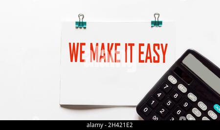 We make it easy, the text is written on a notepad and a white background, Stock Photo