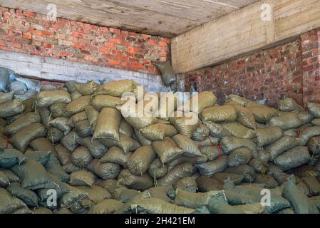 Mountains of sack goods piled up in the chemical warehouse Stock Photo