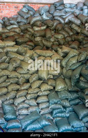 Mountains of sack goods piled up in the chemical warehouse Stock Photo