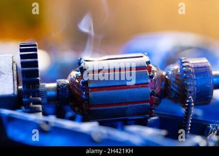 Power tool repair. Disassembled drill. Broken drill metal detail Stock Photo