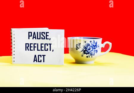 pause, meditation, action concept - abstract word on notepad with a cup of coffee Stock Photo