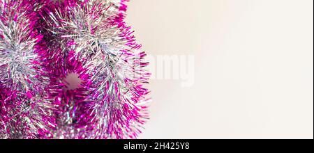 Christmas Tinsel as a border isolated against a white background Stock Photo