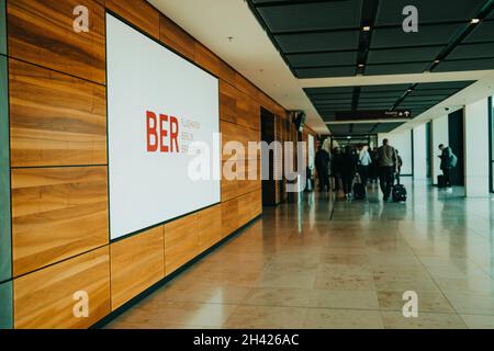 October 2021 - Berlin, Germany. View or Brandenburg airport inside. Arrived passengers go along the corridor to passport control. new terminal Stock Photo