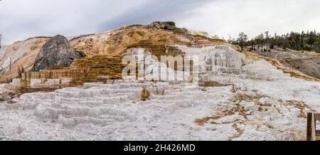 Scenic lifeless calcium terraces at Mammoth Hot Springs, Yellowstone National Park, USA Stock Photo