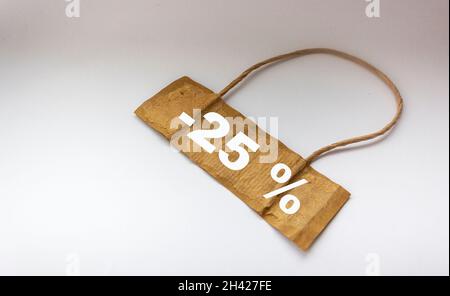 Discount 25 on sale on promotion. On tag and white isolated background 25 percent sale text, advertisement. Stock Photo