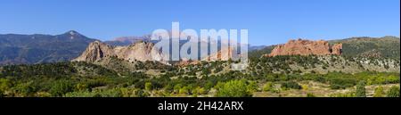 Pikes Peak and the Garden of the Gods in Colorado Springs. Panoramic view under a blue sky Stock Photo