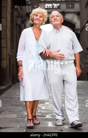 Aged couple on vacation roaming Stock Photo