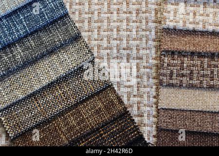 Samples of colorful upholstery fabrics. Various texture and colors. Stock Photo