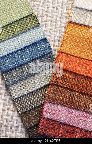 Samples of colorful upholstery fabrics. Various texture and colors. Stock Photo
