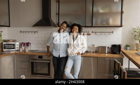 Portrait of happy bonding african couple posing indoors. Stock Photo