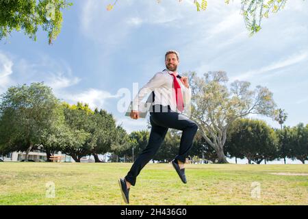 Running businessman ready to run jump and sprint. Stock Photo