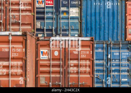 Labuan Bajo, Indonesia - Aug 25, 2019: Several dry van type freight containers stacked in the port area of Labuan Bajo Stock Photo