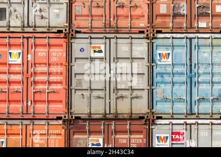 Labuan Bajo, Indonesia - Aug 25, 2019: Several dry van type freight containers stacked in the port area of Labuan Bajo Stock Photo