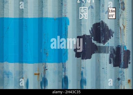 Labuan Bajo, Indonesia - Aug 25, 2019: Texture background of an old dry van type freight container, painted in blue color Stock Photo