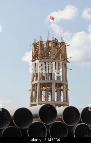 Labuan Bajo, Indonesia - Aug 25, 2019: The concrete structure of a building under construction in the port area of Labuan Bajo Stock Photo