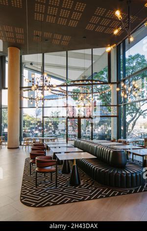 Ground level restaurant interior. Radisson RED Rosebank, Johannesburg, South Africa. Architect: dhk Architects, 2021. Stock Photo