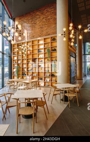 Ground level restaurant interior. Radisson RED Rosebank, Johannesburg, South Africa. Architect: dhk Architects, 2021. Stock Photo