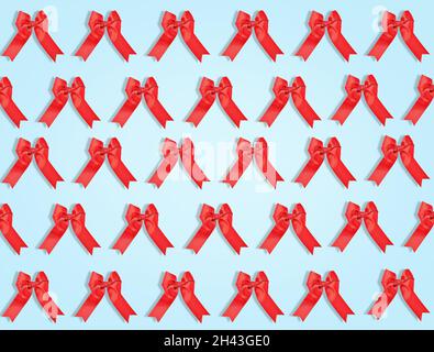Many red bows on light blue background. Pattern for design Stock Photo