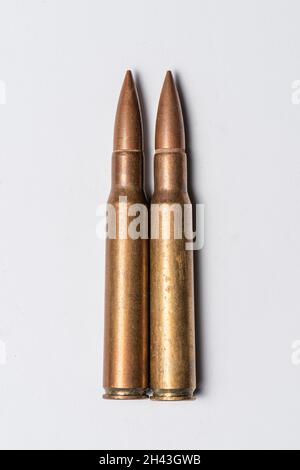 Two rifle bullets on white background.. Stock Photo