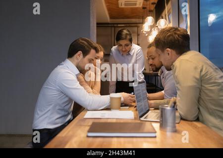 Group of creative diverse employees briefing in office. Stock Photo