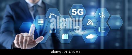 Businessman is pressing on the virtual screen 5G. Fast communication concept. Stock Photo