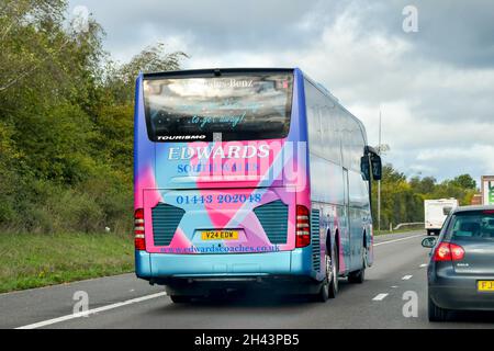 Strensham, England - October 2021: Tour bus operated by South Wales coach holiday company Edwards Travel driving on the M5 motorway Stock Photo